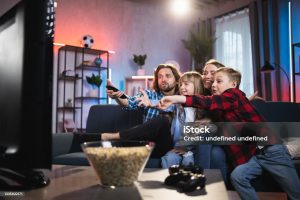 happy family watching television