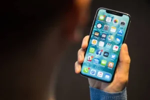 holding iPhone