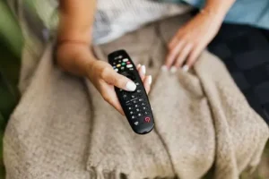 person using remote control