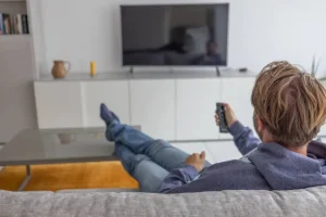 person watching smart tv